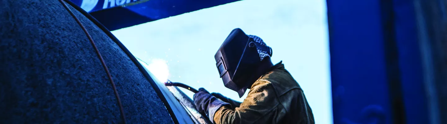Welder works in confined space