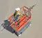 Orange Skyjack scissor lift with a Pipe Cradle Accessory attached