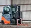 Orange and black Toyota warehouse forklift