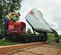 Red and black and white TORO Concrete Buggy, 16 cubic ft., Tracks, Gas Powered