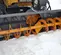 Gray and yellow PALADIN Snow Blower Attachment for Skid Steer