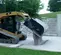 Black Paladin Broom With Bucket Attachment for Skid Steer